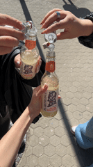 Sofia residents mix drinks on sidewalk near street art