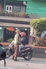 Busy street corner in Harjamekar captures everyday Indonesian urban life