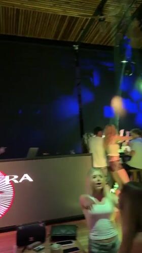 Late-night club scene in Burgas with DJ and dancers