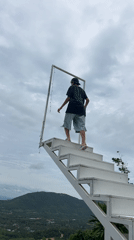Elevated white staircase overlook above Ko Samui's green hills