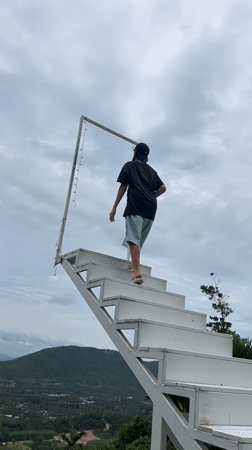 Elevated white staircase overlook above Ko Samui's green hills