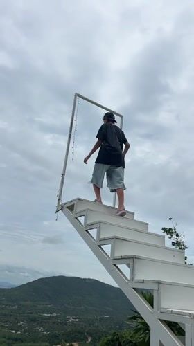 Elevated white staircase overlook above Ko Samui's green hills
