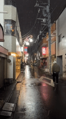 Light snow creates slick conditions on Shibuya street