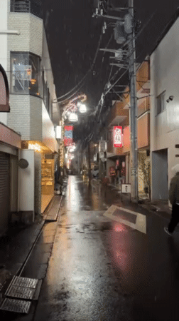 Light snow creates slick conditions on Shibuya street