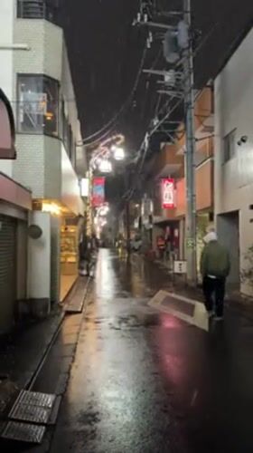 Light snow creates slick conditions on Shibuya street