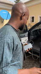 Morning car wash routine captured in Abuja residential area