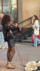 Street violinist performs on Moscow sidewalk
