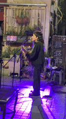 Evening street life, dining, and music captured across Tel Aviv