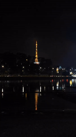 Rainy night scenes captured around illuminated Da Lat lakefront