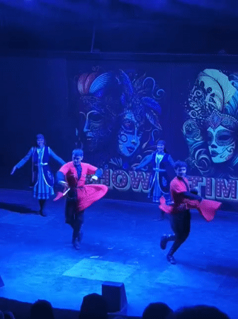 Blue-lit stage dance performance in Kuşadası, Turkey