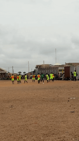 Soccer training session held on dirt field in Bukuru