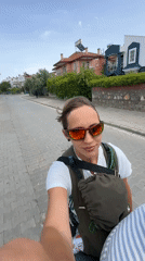 Motorcycle riders travel through residential Fethiye, Turkey streets