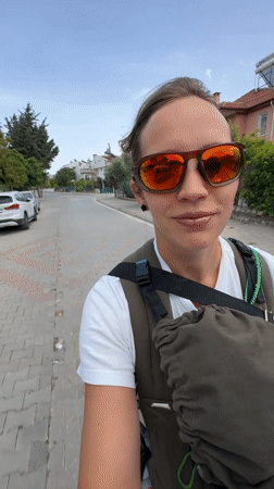 Motorcycle riders travel through residential Fethiye, Turkey streets