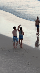 Dancing and a dog on a cloudy Tel Aviv beach