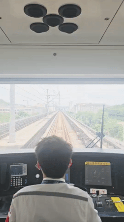 Train driver filmed operating elevated railway in Liangjiang, China