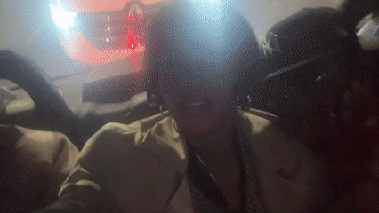 Two people observed in moving car during London night