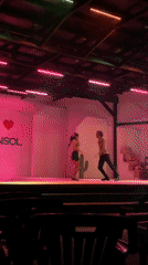 Night stage performance in El Tirano with dancers and festive backdrop