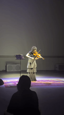 Solo musicians perform on stage in Almaty