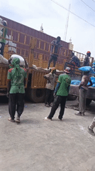 Workers Unload Truck at Nigerian Market in Fagge