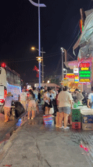 Crowded nighttime street scene captured in Phu Thuy Ward