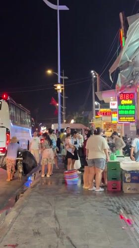 Crowded nighttime street scene captured in Phu Thuy Ward