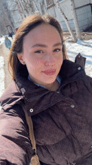 Woman records selfie video while walking in Surgut