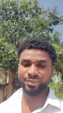 Man makes playful faces at camera in Obosi, Nigeria