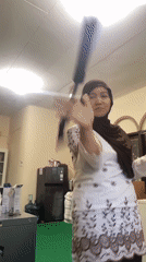 Selfie stick spinning during a casual indoor self-recording session