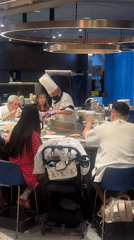 Diners watch teppanyaki chefs cook at Taipei restaurant