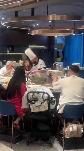 Diners watch teppanyaki chefs cook at Taipei restaurant