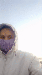 Person watches sunrise by water in Sarandí, Argentina