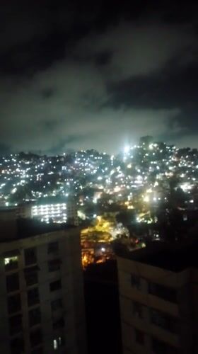 Pre-dawn Caracas cityscape captured from multiple high vantage points