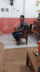Casual indoor community gathering with live guitar in Semarang