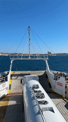 Ferry passenger films tanker truck on deck near Italian coast
