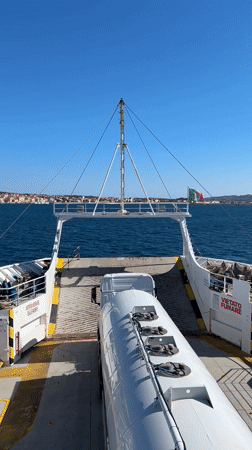 Ferry passenger films tanker truck on deck near Italian coast