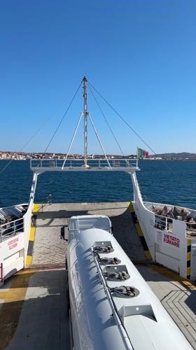 Ferry passenger films tanker truck on deck near Italian coast