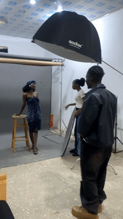 Model poses in blue strapless outfit at Nigeria photography studio