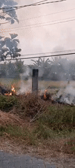 Grass fire and dusky rural scenes in Bendungan, Indonesia