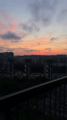 Dusk cityscape captured over Kudrovo, Russia high-rises