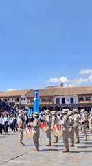 University workers march in formal procession through historic Cuzco plaza