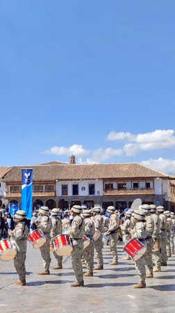 University workers march in formal procession through historic Cuzco plaza