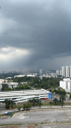 Dark clouds blanket Kuala Lumpur skyline Monday morning