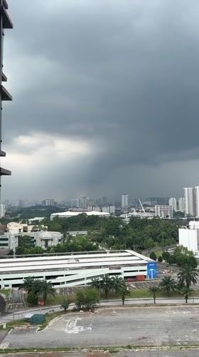 Dark clouds blanket Kuala Lumpur skyline Monday morning