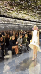 Dior fashion show features mirrored runway, floral accents in Paris