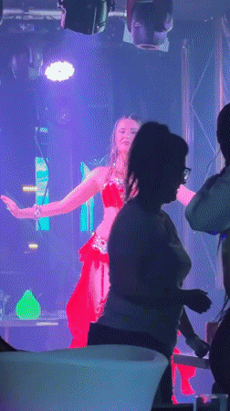 Live belly dance and packed dance floor at Dubai nightclub