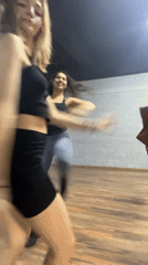 Young women dance and practice with umbrellas in Mexico studio
