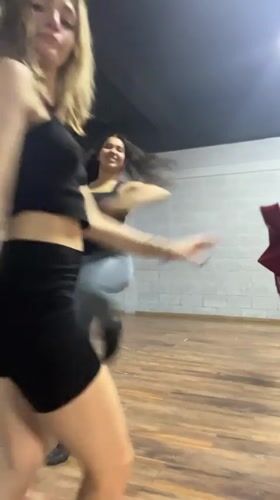 Young women dance and practice with umbrellas in Mexico studio