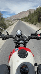 First-person motorcycle ride through Sumur's arid Ladakh roads