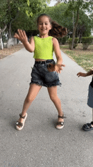 Dancing and playing around on a park path in Yevpatoriya