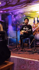 Musicians perform at cafe in Haini, India